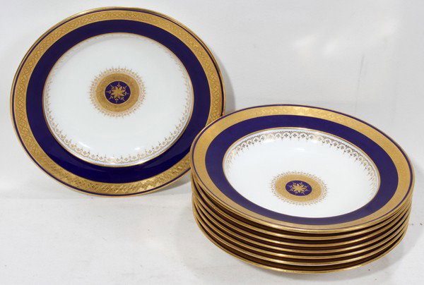 MINTON FIRED GOLD PORCELAIN PLATES, SET OF 8: MINTON FIRED GOLD PORCELAIN PLATES, RETAILED BY TIFFANY & CO., SET OF EIGHT, DIA 8 1/4":Each decorated with a cobalt blue rim and fired gold accents. Marked on the back with trade mark logo along with