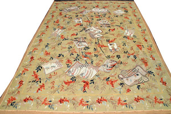 AUBUSSON DESIGN RUG, 11' 10" X 8' 8": AUBUSSON DESIGN RUG, 11' 10" X 8' 8":having a beige ground one wide border and floral designs accented by colorful designs depicting paper pages fabric designs.