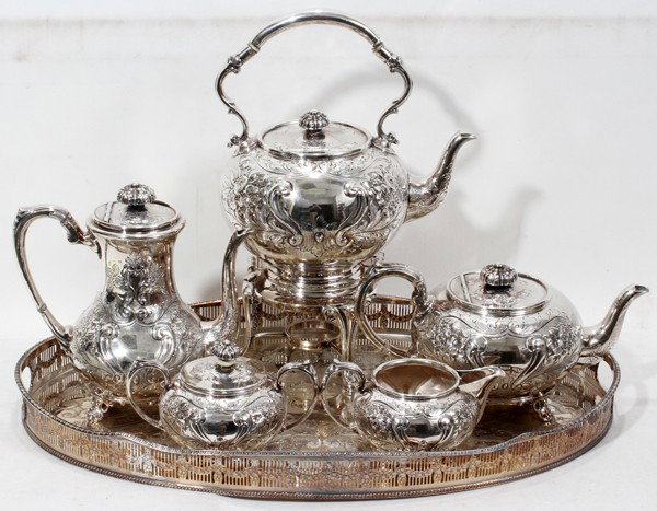 SHEFFIELD SILVER PLATE TEA/COFFEE SERVICE, 6: SHEFFIELD SILVER PLATE TEA/COFFEE SERVICE, SIX PIECES:Featuring a water kettle with stand, teapot, coffee pot, covered sugar, creamer and tray with pierced gallery L 22", D 15".