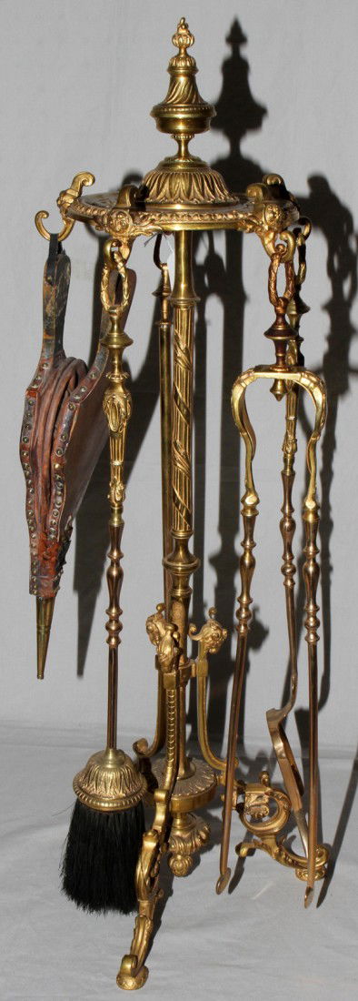 5 PIECE FIRE TOOL SET ON STAND H 34": 5 PIECE FIRE TOOL SET ON STAND H 34":Pierced design; includes poker, tongs, brush, shovel plus bellows.