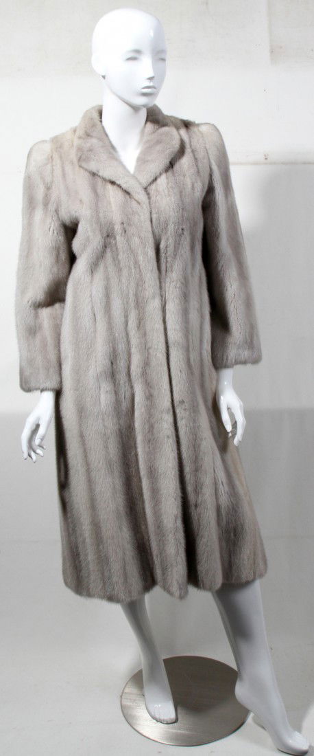 SILVER MINK COAT: SILVER MINK COAT:Three-quarter length, measures L.45" from shoulder to hem, three hook closures with monogram embroidered at the silk lining, slit pockets. Ferris Brothers of Saginaw, Michigan label.