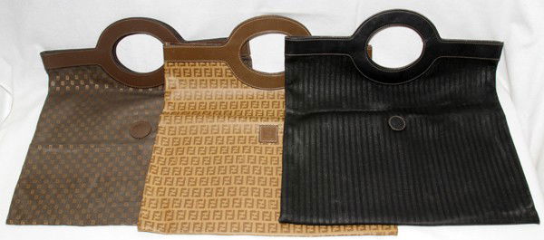 FENDI SHOPPER TOTES, THREE, W 15 1/2": FENDI SHOPPER TOTES, THREE, W 15 1/2":Brown, tan and black; measures 17 1/2" to the handles.