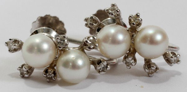 4MM PEARL EARRINGS WITH DIAMOND ENHANCEMENT: 4MM PEARL EARRINGS WITH DIAMOND ENHANCEMENT, WHITE GOLD:Impressed 14 kt . From the Estate of Gloria Vuici - Smith, Grosse Pointe, Mi.