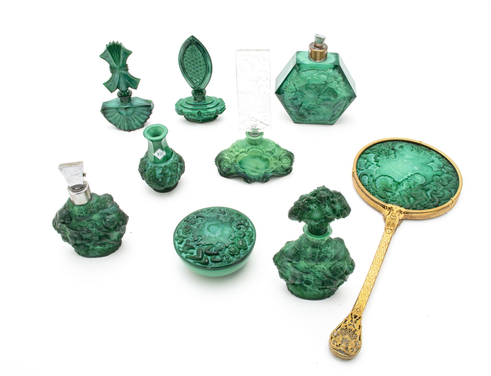 Bohemian Malachite Glass Perfume Bottles, Atomizers, Vase, Box & Mirror, C. 1930, L 15'' 9 pcs: Bohemian Malachite Glass Perfume Bottles, Atomizers, Vase, Box & Mirror, C. 1930, L 15'' 9 pcs A collection of semi-antique Bohemian malachite glass articles includes four perfume bottles (H 5.5"-7.75