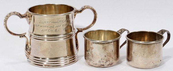 STERLING TROPHY AND CUPS (2), 3 PCS., H 3"-6": STERLING TROPHY AND CUPS (2), 3 PCS., H 3" - 6":Two matching Robert Lunt Silver Co. small cups with handles, 2.11 tr. Oz, 1 3/4" H.; Third cup is manufactured by "Wood & Hughs" Silver Co. and inscribe