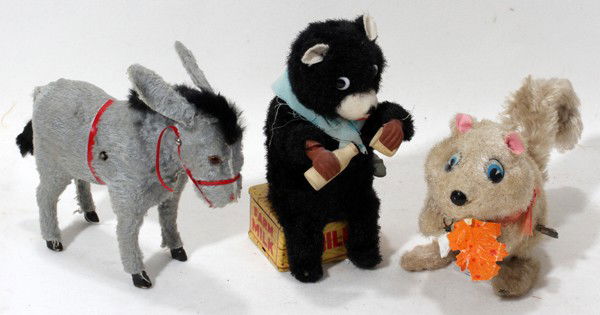 WIND UP TOYS: DONKEY, BEAR AND SQUIRREL,: WIND UP TOYS: DONKEY, BEAR AND SQUIRREL, C 1930 - 40:Donkey, L 6", bear and squirrel, H 4 1/2",. Windup, marked Farm Milk and Japan, wind up mechanism with bottle and cup going to the bear,fair condit