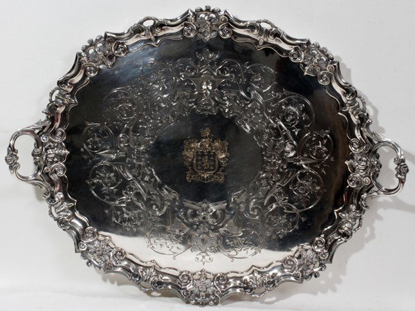 VICTORIAN SILVERPLATE TRAY BY SMITH, SISSONS : VICTORIAN SILVERPLATE TRAY BY SMITH, SISSONS & CO., SHEFFIELD, 19TH C., L 29 3/4":Chased coat of arms at the well within a scroll and vine border, the shaped rim and scroll handles adorned with roses;