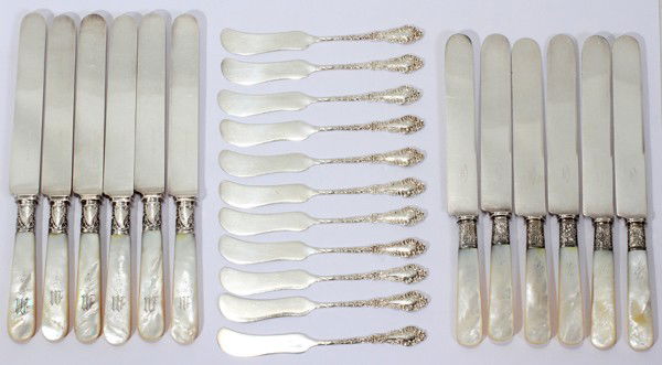 STERLING BUTTER SPREADERS & KNIVES (12), L 9": STERLING BUTTER SPREADERS (11) & MOTHER-OF-PEARL KNIVES (12), L 9":Including a set of 11 sterling silver butter spreaders by Frank Smith Silver Co., engraved initial at the tip, totaling approximately
