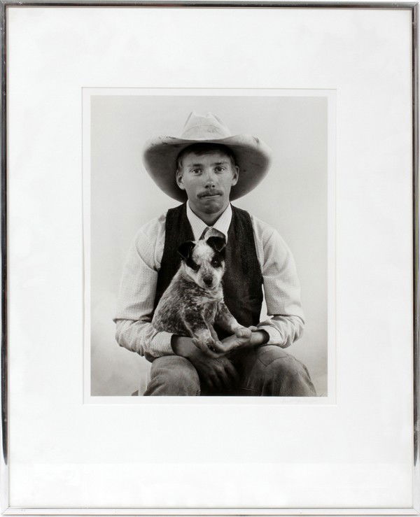 KURT MARKUS PHOTOGRAPH, 12" X 9", RANCH HAND: KURT MARKUS (1947-), PHOTOGRAPH, 12" X 9", RANCH HAND WITH DOG:Pencil signed lower right, framed. Kurt Markus, American, born 1947; self-taught American photographer, was born in rural Montana.