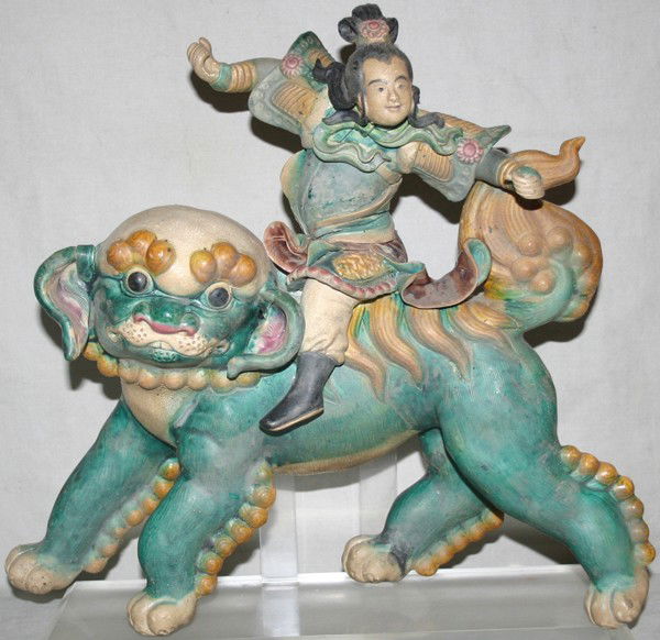 CHINESE EARTHENWARE FIGURAL ROOF TILE, H 13",: CHINESE EARTHENWARE FIGURAL ROOF TILE, H 13", W 14":Impressed 13-3 on the reverse; 20th century. Mounted on an acrylic stand.