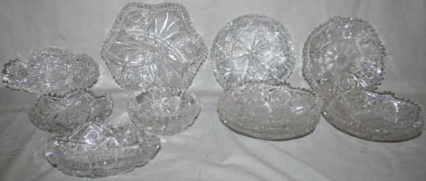 CUT GLASS DISHES, TWELVE, DIA 4 1/2" - 6": CUT GLASS DISHES, TWELVE, DIA 4 1/2" - 6":Including 1 Gowens Kent & Co. hexagonal bowl, W. 7 1/4", a set of 6 dessert dishes, W. 6", 1 relish dish, L. 6 3/4", and 4 other bowls, Dia. 4 1/2" - 6".