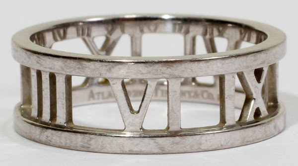 TIFFANY & CO. 'ATLAS' 18 KT WHITE GOLD RING: TIFFANY & CO. 'ATLAS' 18 KT WHITE GOLD RING:Marked "Atlas (copyright) 2003 Tiffany & Co. 750". Size is 7 1/2. Approximately 5.1 grams. Includes a Tiffany felt box.