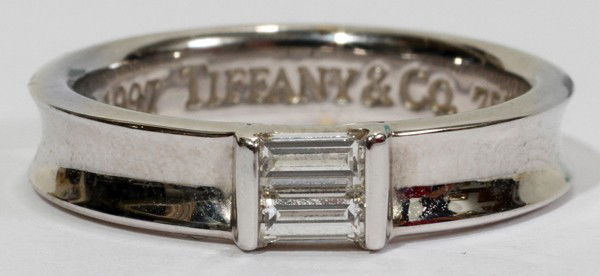 TIFFANY & CO. 18 KT WHITE GOLD & DIAMOND RING: TIFFANY & CO. 18 KT WHITE GOLD & DIAMOND RING:Tiffany stack ring is stamped "(copyright) 1997 Tiffany & Co. 750". Totaling approximately 5.8 grams. Includes Tiffany & Co. felt box; size 7.