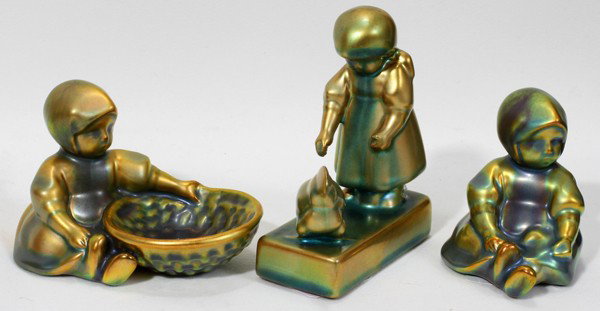 ZSOLNAY PORCELAIN IRIDESCENT GIRL FIGURINES, 3: ZSOLNAY PORCELAIN IRIDESCENT GIRL FIGURINES, THREE, H 4 1/4", 2 3/4":4 1/4", 2 3/4", 2 3/4". From the Estate of Mary Grace Pribanyec, Lincoln park From the Estate of Mary Grace Pribanyec, Lincoln Park