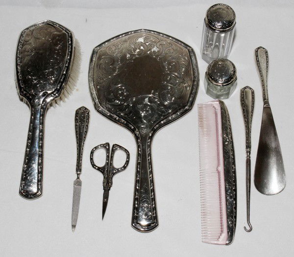 AMERICAN STERLING DRESSER SET, EIGHT PIECES,: AMERICAN STERLING DRESSER SET, EIGHT PIECES, L 4" - 11 1/2":Including 1 pair of nail scissors, 1 nail file, 2 glass jars with sterling lids, 1 comb, 1 shoe horn, 1 hair brush and 1 hand mirror. Faintl