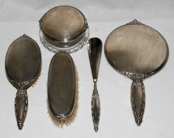 AMERICAN STERLING DRESSER SET, FIVE,: AMERICAN STERLING DRESSER SET, FIVE, L 6 1/2" - 11":Including 1 hand mirror, 1 hairbrush, 1 clothes brush, 1 shoehorn and 1 crystal powder jar with sterling lid. Matching set; worn maker's marks.