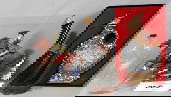 090472: JIM BEAM, GARRETTS, REVERE, PORCELAIN BOTTLES: JIM BEAM, GARRETTS, DICKEL TENN., PAUL REVERE MC CORMICKS DISTILLING, PORCELAIN BOTTLES, FOUR:Jim Beam in original box raised figures cherubs H12" W7". Garretts American wines pressed glass bottle. H1