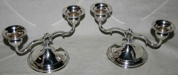 STERLING TWO LIGHT CANDLE STICKS: STERLING TWO LIGHT CANDLE STICKS:marked 102/24 A and "L" mark at the base (possibly Lebkuecher & Co.). Weightet:7.97 troy oz. W 7 1/2" H 4"