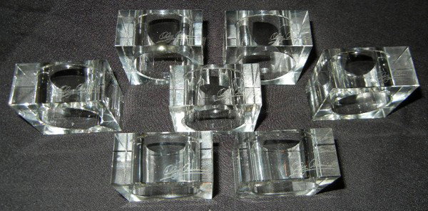 OLEG CASSINI GROUPING OF NAPKIN RINGS, 7 PCS: OLEG CASSINI GROUPING OF NAPKIN RINGS, 7 PCS, DIA 2":Square. Signed.