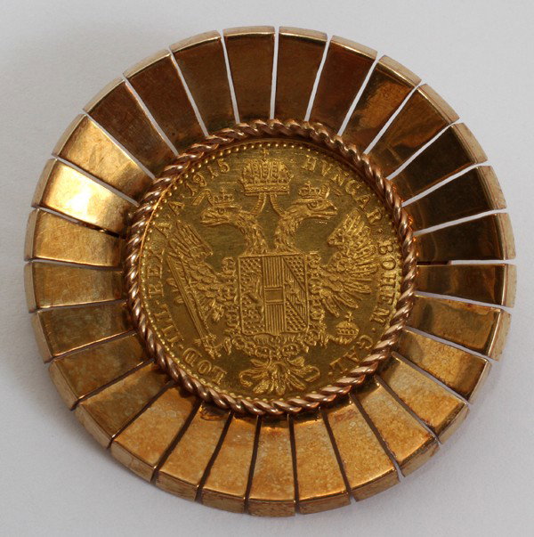 AUSTRIAN GOLD FRANC MOUNTED AS BROOCH, 1915: AUSTRIAN GOLD FRANC MOUNTED AS BROOCH, 1915:22kt. Austrian Ducat 1915 Gold Coin in 14kt Gold Bezel.On one side it states " Franc IOS I D G Avstriae Imperator " other side states " LOD ILL REX A A 1915