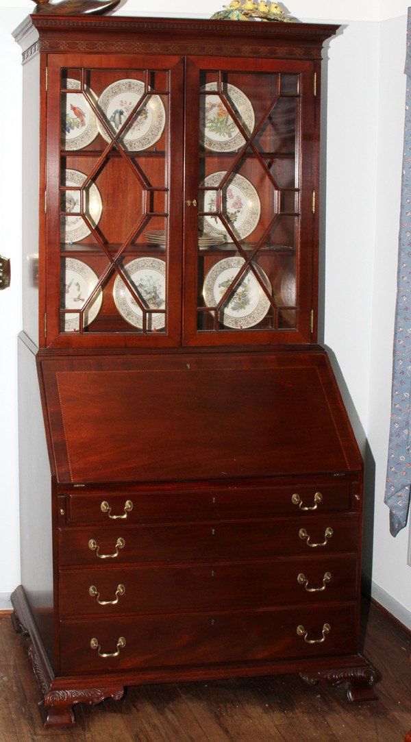 LINK-TAYLOR HEIRLOOM MAHOGANY SECRETARY, H 85": LINK-TAYLOR HEIRLOOM MAHOGANY SECRETARY, H 85", W 40", D 21", GEORGIAN STYLE:Having a fenestrated bookcase top and 4 graduated drawers. From the Estate of Robert and Elizabeth Mandy, Bingham Farms, Mi