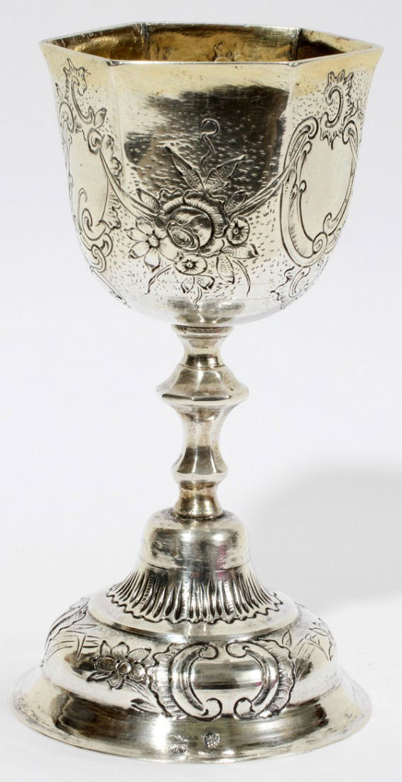 GERMAN SILVER GILT GOBLET, C. 1900, H 5 3/4": GERMAN SILVER GILT GOBLET, C. 1900, H 5 3/4", LIKELY HANAU:A silver goblet, or cup, having a gilt hexagonal bowl with floral swags and scrolled reserves, raised on a baluster stem and domed base with