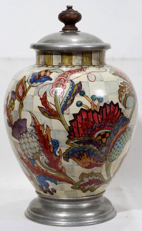 MACKENZIE-CHILDS POTTERY & PEWTER COVERED URN: MACKENZIE-CHILDS POTTERY & PEWTER COVERED URN, H 17 1/2", DIA 10 1/2":Featuring a crackle glaze with floral and fruit designs. On a pewter base with a pewter lid.