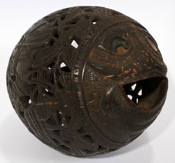 CARVED AND PIERCED COCONUT BANK, H 3", L 4": CARVED AND PIERCED COCONUT BANK, H 3", L 4":Featuring two horsemen, two women dancing and overall agave leaf motif. Also depicts a face with mother of pearl eyes.