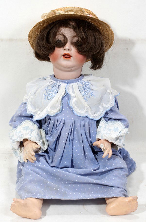 SIMON HALBIG BISQUE HEAD DOLL, H 24": SIMON HALBIG BISQUE HEAD DOLL, H 24":Having an open mouth and wearing a blue dress. Marked 1310-63.