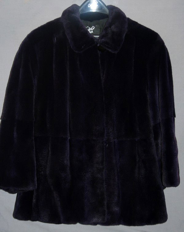 CERESNIE & OFFEN DARK PURPLE MINK JACKET: CERESNIE & OFFEN DARK PURPLE MINK JACKET:Medium and petite in size. Has a short collar and hooks down the front.