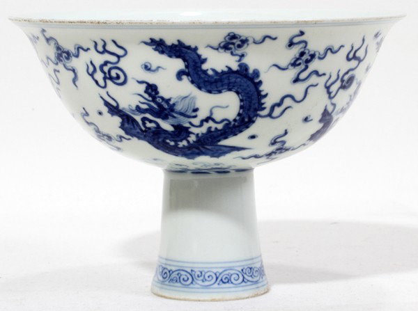 CHINESE BLUE WHITE PORCELAIN PEDESTAL BOWL,: CHINESE BLUE WHITE PORCELAIN PEDESTAL BOWL, H 4 1/8", DIA 6":Featuring dragons, clouds and bats.