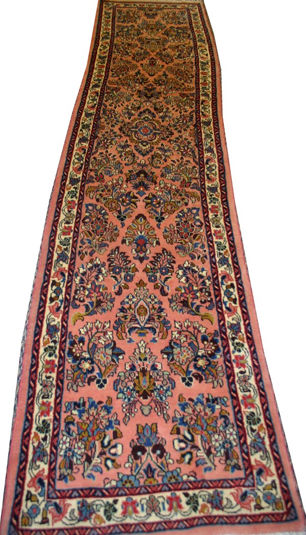 SAROUK PERSIAN RUNNER, 11' 1" X 2' 6": SAROUK PERSIAN RUNNER, C. 1960-70, 11' 1" X 2' 6":having a pink ground, three borders with flowers throughout;
