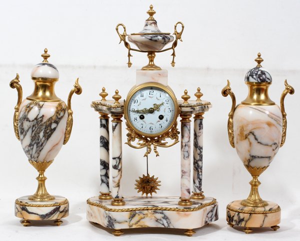 FRENCH MARBLE CLOCK & GARNITURE SET 3 PCS: NEOCLASSICAL STYLE FRENCH MARBLE CLOCK & GARNITURE SET, THREE PIECES, H 15" - 19":Including 1 clock with an urn form finial, a circular enameled dial with Arabic numerals and 2 two side pieces each of