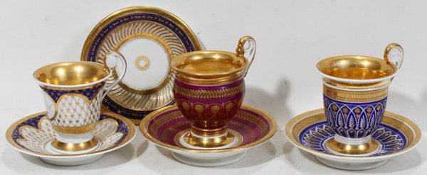 KPM HAND PAINTED PORCELAIN CUP & SAUCER, 19TH C: KPM HAND PAINTED PORCELAIN CUP & SAUCER, 19TH C., & TWO OTHER SETS & A SAUCER, SEVEN PIECES:Including 1 hand painted cup and saucer with "Robert" enclosed within a vignette, both pieces with maker's m