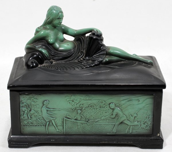 ART DECO PAINTED METAL HUMIDOR 6" 7": ART DECO PAINTED METAL HUMIDOR, H 6", W 3 1/2", L 7":Surmounted by a partially nude female figure, with four panel sides that each depict a different sport: tennis, football, golf and polo. Stamped "P