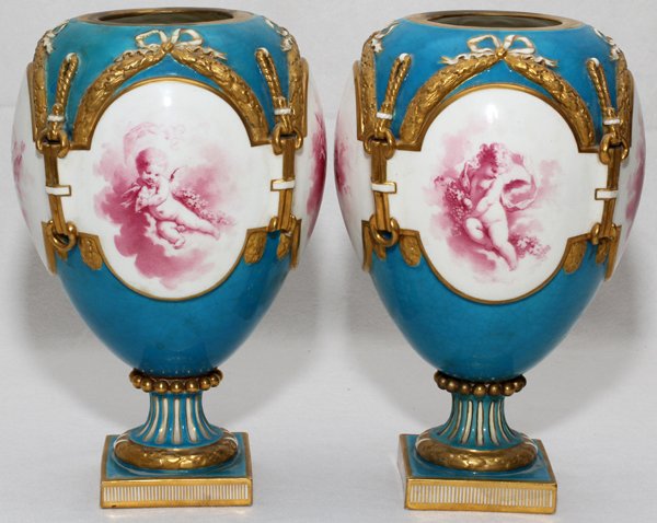 MINTON PORCELAIN URNS LATE 19TH C.: MINTON PORCELAIN URNS, LATE 19TH C., PAIR, H 9 1/2", W 5 1/2":Each of ovoid shape with cartouche at each side enclosing putto allegories, including love and the seasons, on a turquoise blue ground wit