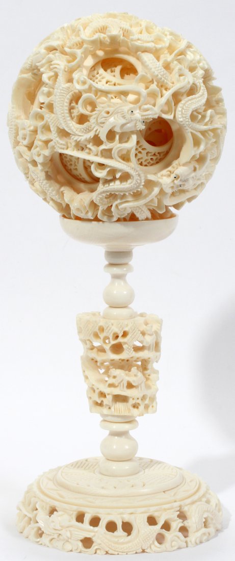 CHINESE IVORY PUZZLE BALL ON STAND 8.5": CHINESE IVORY PUZZLE BALL ON STAND H 8.5":Numerous free turning concentric balls dia. 3.5". Approximately 8 to 10 balls. IVORY CANNOT BE SHIPPED OUTSIDE OF THE CONTINENTAL UNITED STATES.