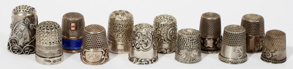 AMER. & CONTINENTAL STERLING, SILVER & THIMBLES: AMERICAN & CONTINENTAL STERLING, SILVER & PLATED THIMBLES, ANTIQUE, TWELVE, H 3/4" - 1 1/4":Including 7 thimbles marked "Sterling" (including Simons Bros and Ketcham and McDougall) and 1 with English 