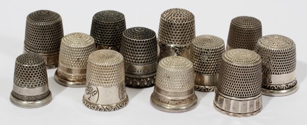 AMER. STERLING & THIMBLES, SMALL & CHILD'S SIZE: AMERICAN STERLING & SILVER THIMBLES, SMALL & CHILD'S SIZE, C. 1900, TWELVE:11 of the thimbles are marked sterling by various makers including Simons Bros., Ketcham McDougall and Waite, Thresher & Co.,