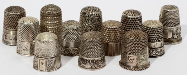 AMERICAN & ENGLISH STERLING & THIMBLES: AMERICAN & ENGLISH STERLING & SILVER THIMBLES, C. 1900, TWELVE, H 1":Including 6 American sterling thimbles by companies that include Waite, Thresher & Co. and Webster Co. and 1 English sterling thimb