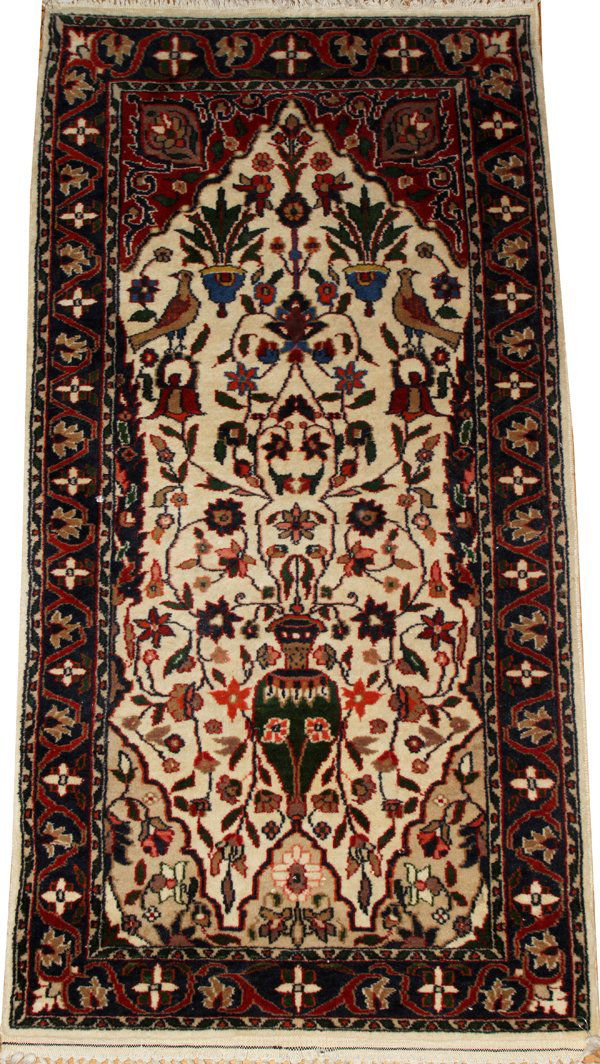 KASHMIR ORIENTAL PRAYER RUG, 4' 0" X 2' 0": KASHMIR ORIENTAL PRAYER RUG, 4' 0" X 2' 0", TREE OF LIFE PATTERN:Pakistan. All wool. Hand woven. 24" x 47". Ivory field, blue border. From the collection of Dr. Robert Walkowiak, Canton, Mich.