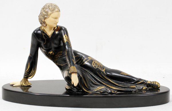 MENNEVILLE E. SPELTER & IVORINE SCULPTURE,: E. MENNEVILLE (FRENCH 20TH C.), ART DECO COLD PAINTED SPELTER & IVORINE SCULPTURE, H 8", L 16", D 6":Depicting a reclining young woman, dressed in a black formal evening dress enhanced in silver with 