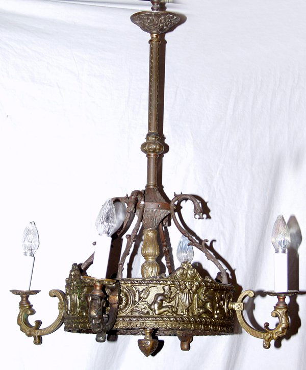 ART DECO BRONZE FOUR LIGHT CHANDELIER ANTIQUE: ART DECO BRONZE FOUR LIGHT CHANDELIER, ANTIQUE, H 37", DIA 33":Central shaft under a ceiling cap with Rose motif, tapering down to a circular base, which is held to the shaft with dragon form arms. Ba