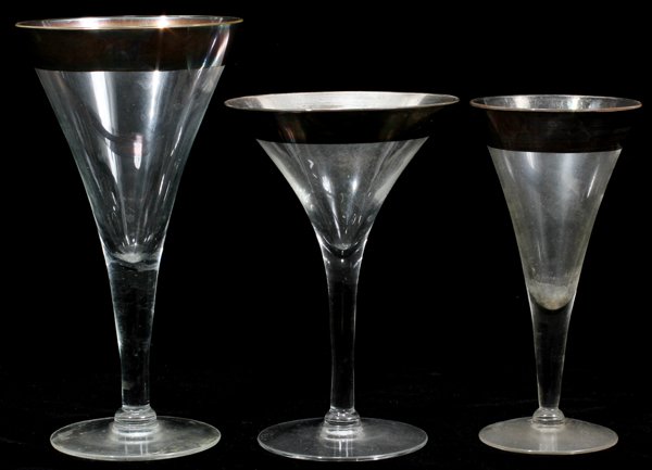 BLOWN GLASS STEMWARE W/SILVER RIMS, 21, 6"-7": BLOWN GLASS STEMWARE WITH SILVER RIMS, 21, H 6" - 7":Including 7 sparkling wine glasses, 9 wine glasses and 5 cocktail glasses. Height of tallest glass is 7 1/2". No apparent markings.