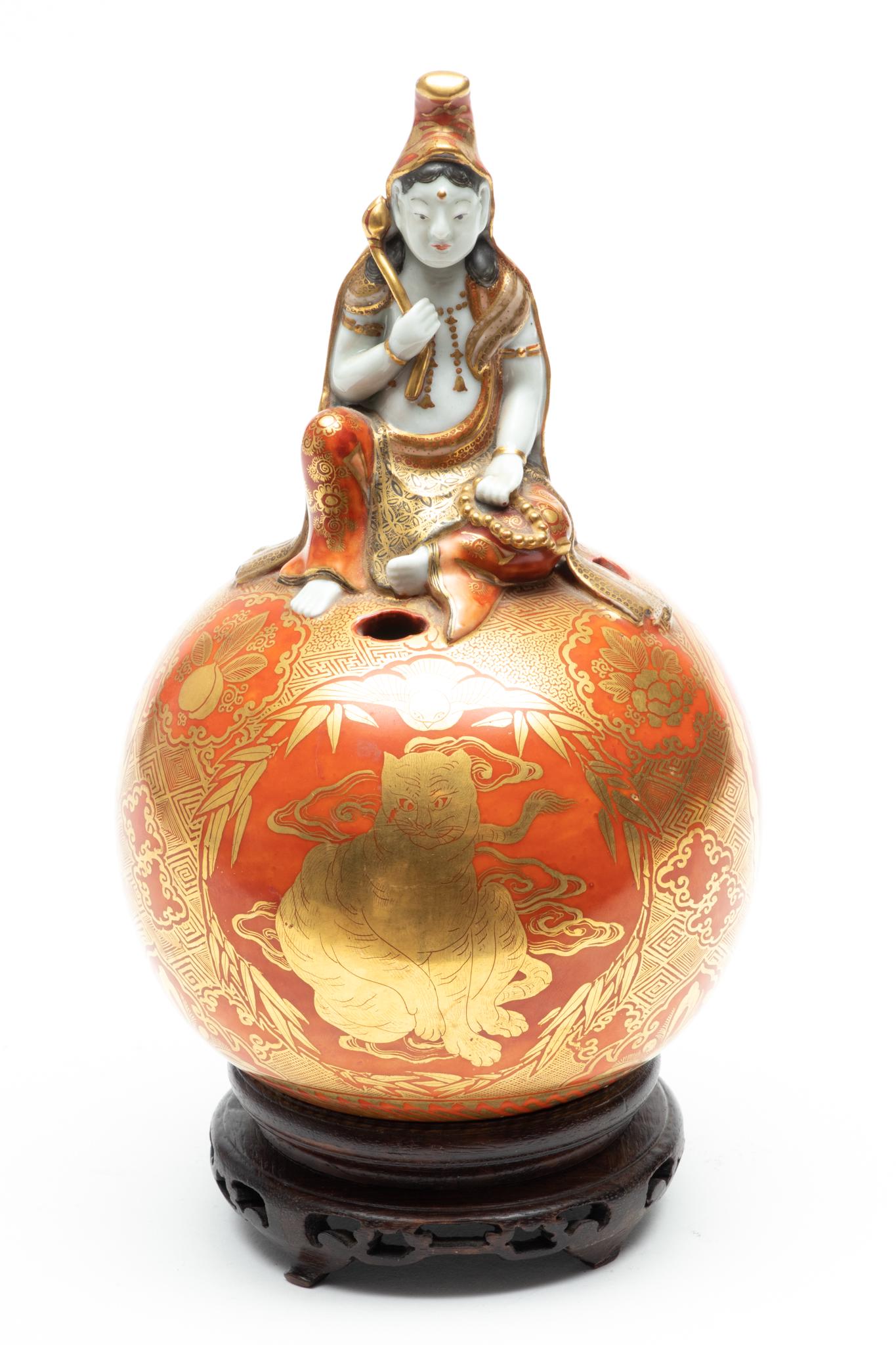Japanese Porcelain Kutani Orb Surmounted By Warrior H 8" W 5": Japanese Porcelain Kutani Orb Surmounted By Warrior H 8" W 5" | Red ground, bright gilding. Provenance: From the Estate of Prominent Collector, Leon Zielinski, Macomb County, MI