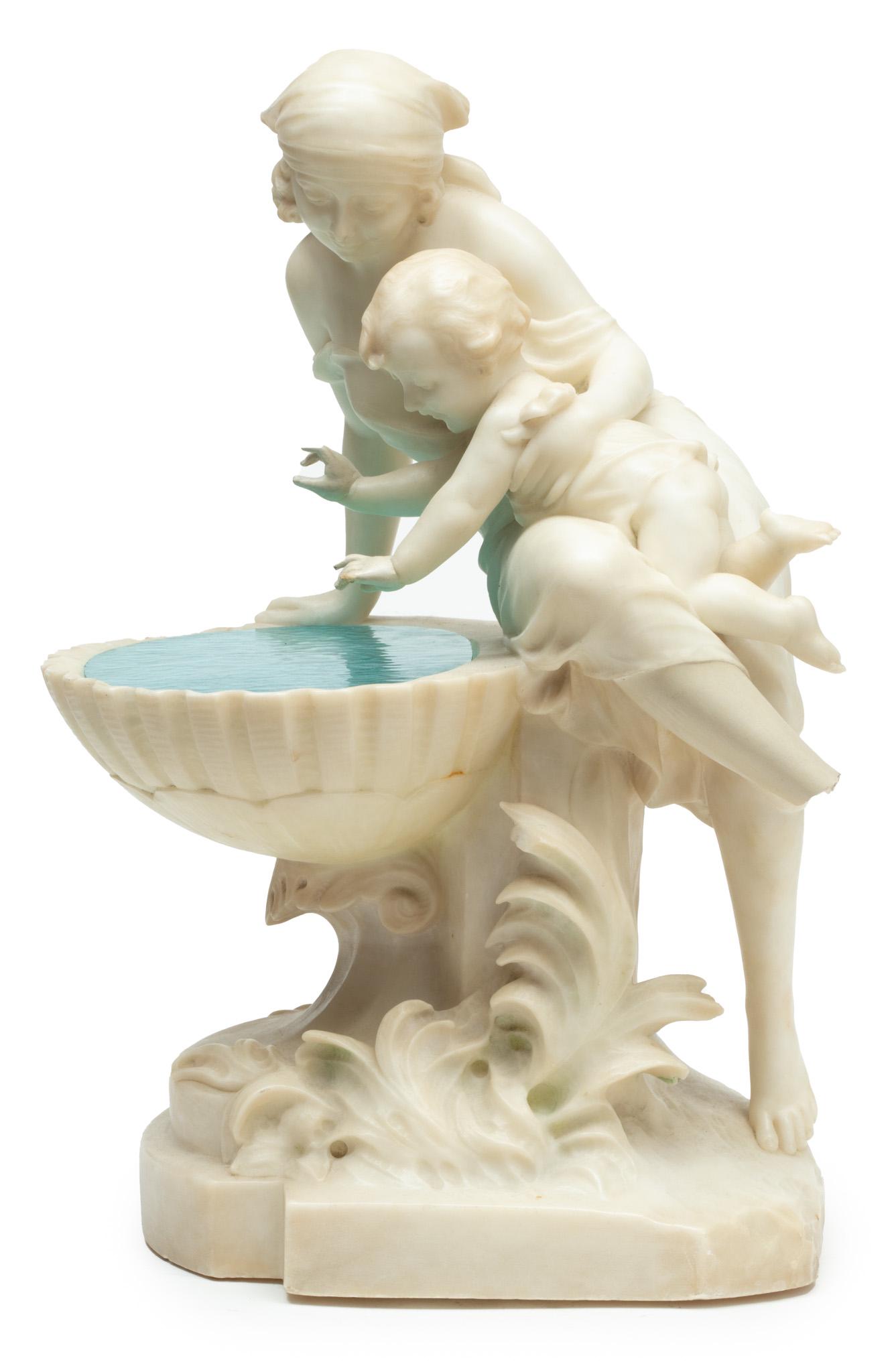 Pietro Bazzanti (Italian) Carved Marble Sculpture H 19.5" W 13" Depth 10.5": Pietro Bazzanti (Italian) Carved Marble Sculpture H 19.5" W 13" Depth 10.5" | Woman and child seated on the edge of a fountain. Signed "P. Bazzanti, Florenza 1928"