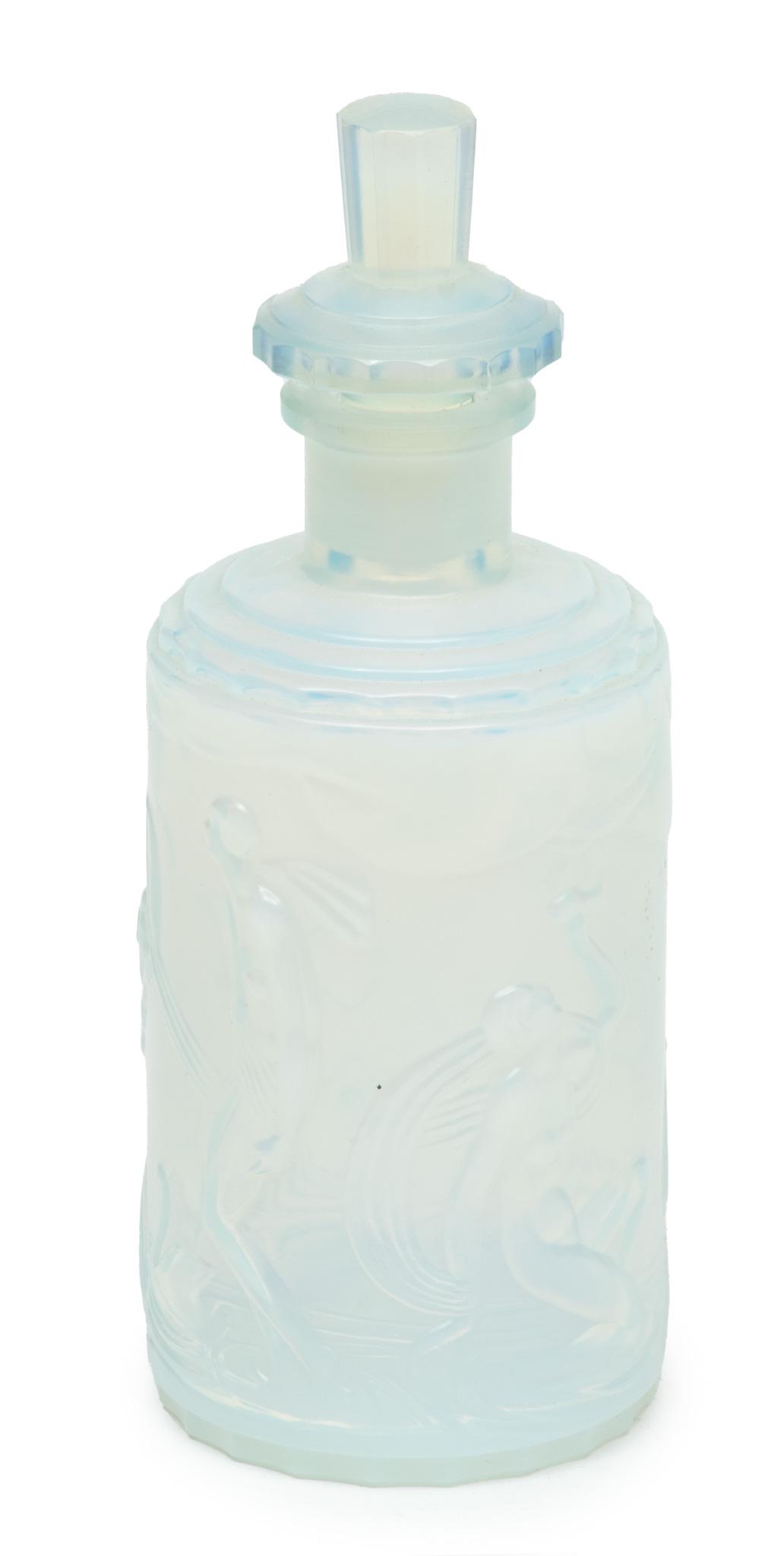 Sabino, Paris,Glass Perfume Bottle, Opalescent, Raised Motif Of Nudes H 6": Sabino, Paris,Glass Perfume Bottle, Opalescent, Raised Motif Of Nudes H 6" | Signed Sabino and Paris. Etched glass. Also original sticker. Light blue transparent milky glass. Provenance: From the Esta