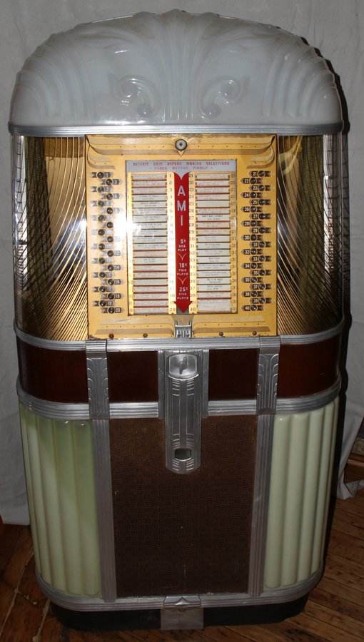 AMI MODEL B JUKEBOX, #20799, C 1947-1949, 64" H: AMI MODEL B JUKEBOX, #20799, C 1947-1949, 64" H. X 32" W. X 24" D:AMI "Model B" takes 5 cents for 1 play, 10 cents for 2 plays and 25 cents for 5 plays; front panel displays 40 selections; holds 20, 7