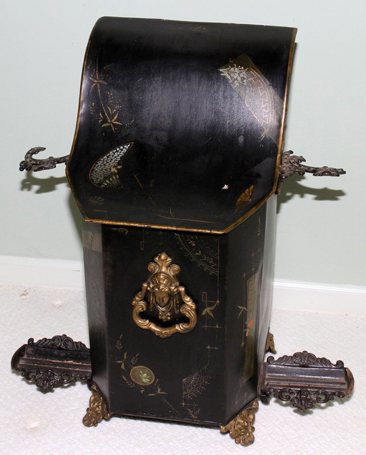 ENGLISH TOLE FIREWOOD BOX, 19TH C., H 25",: ENGLISH TOLE FIREWOOD BOX, 19TH C., H 25", W 11":Hinged cover, side brackets hold brass fireplace tools. From the Estate of Julie Cudlip Whitman, Grosse Pointe Farms.
