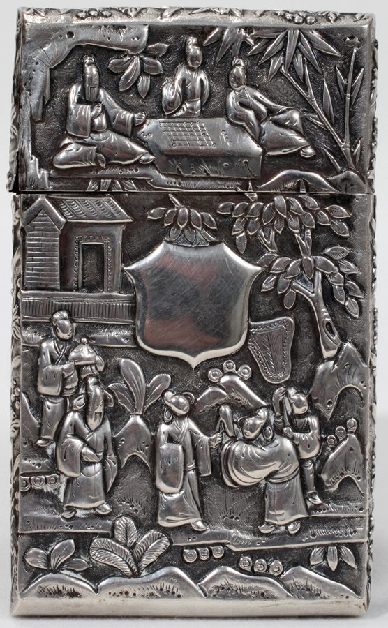 CHINESE SILVER CARD CASE, C. 1900, L 4": CHINESE SILVER CARD CASE, C. 1900, L 4":Decorated overall in a repousse fashion depicting village scenes with bamboo groves overall, including the removable cover. Stamped on the underside with rubbed